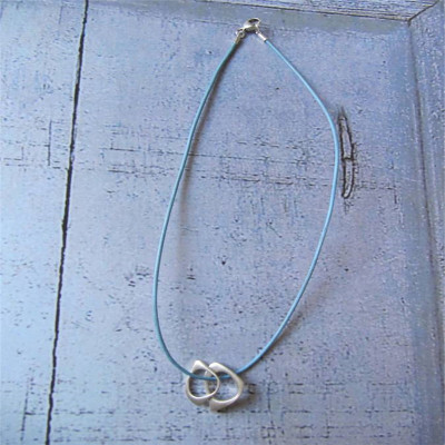 Solid Gold U And Me Infinity Pendants On Leather