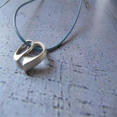 Solid Gold U And Me Infinity Pendants On Leather