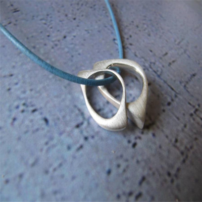 Solid Gold U And Me Infinity Pendants On Leather